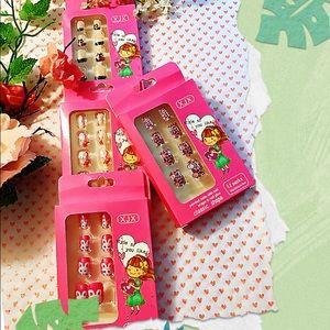 Four Packs pre- glued press on Nails